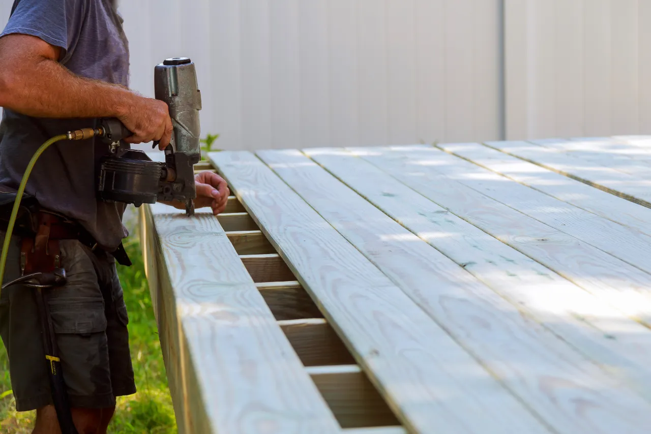 Worker building a backyard deck in New Jersey