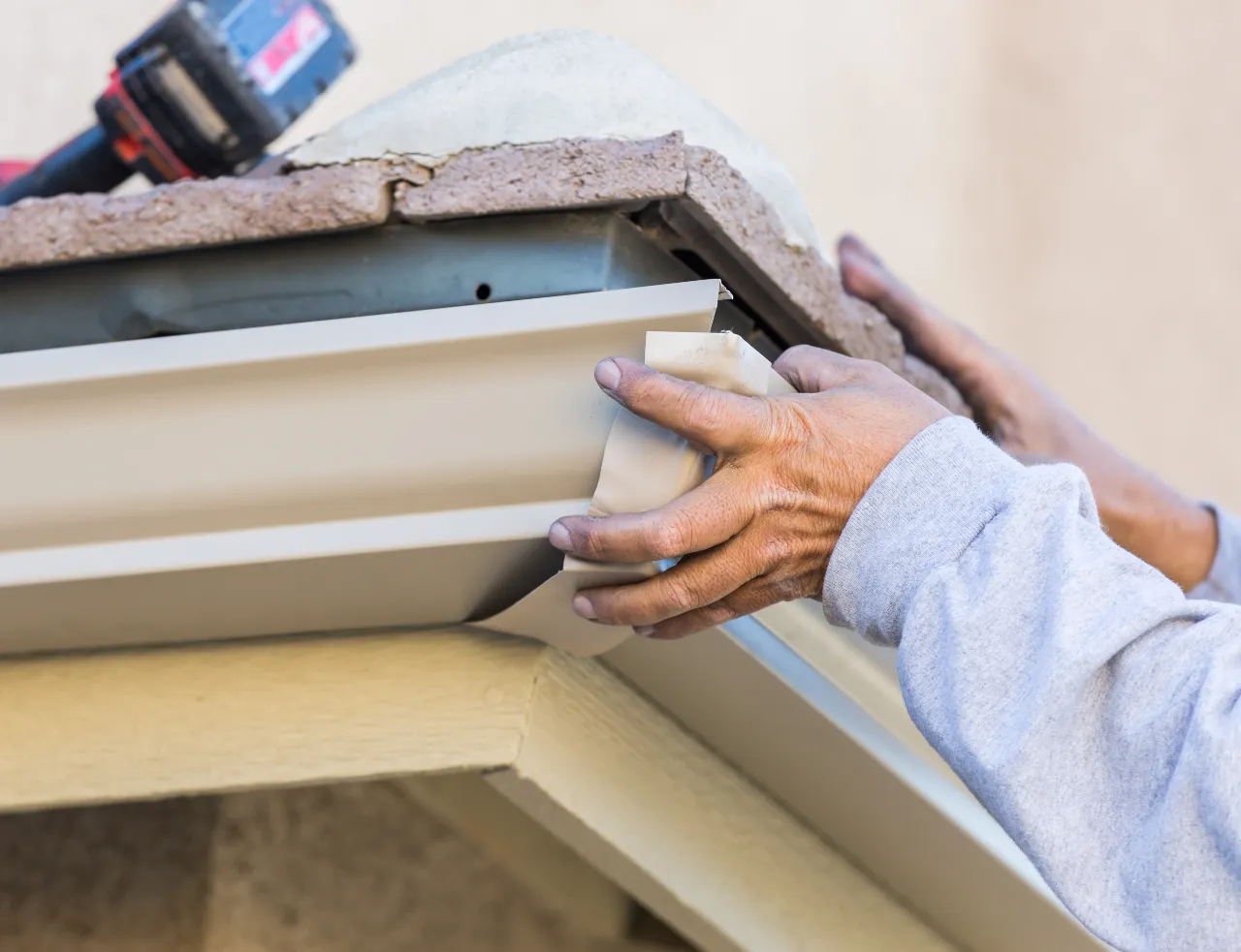 Craftsman repairing gutter on a home in New Jersey