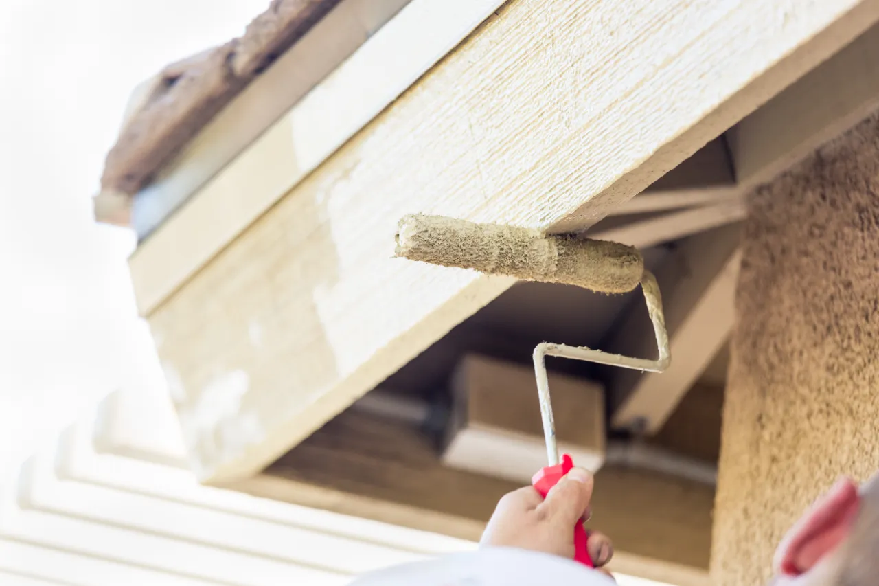 Painting house exterior with roller in New Jersey